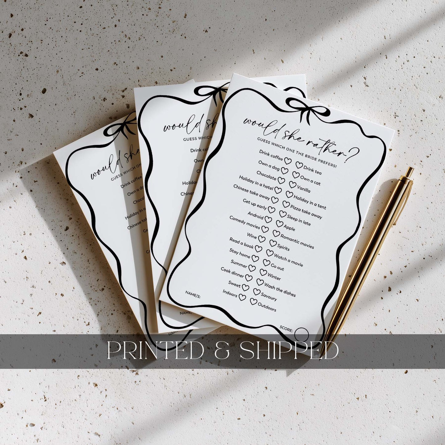 Two printed questionnaires titled 'would she rather?' on a textured surface with a pen.