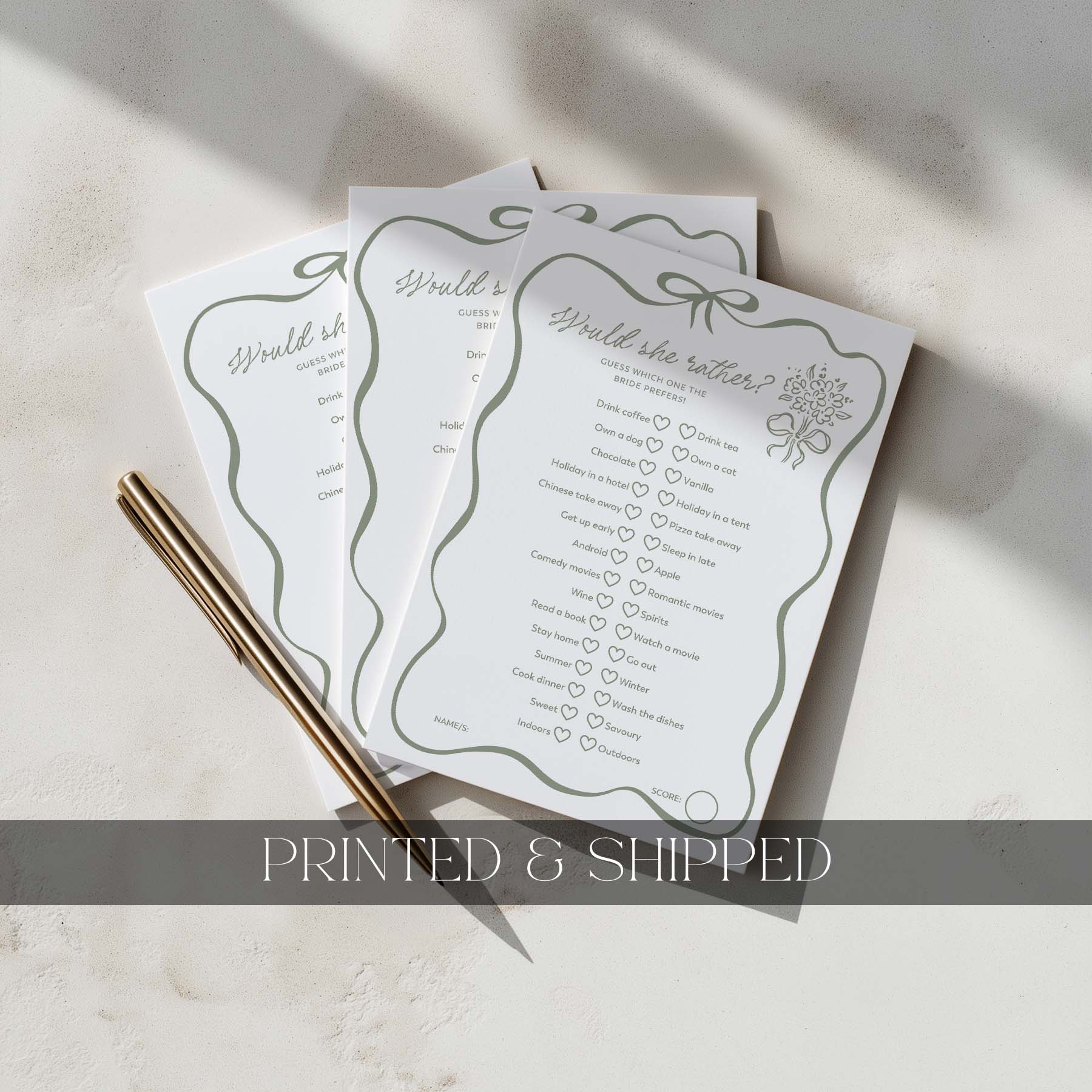 Three printed questionnaires on a light surface with a gold pen.