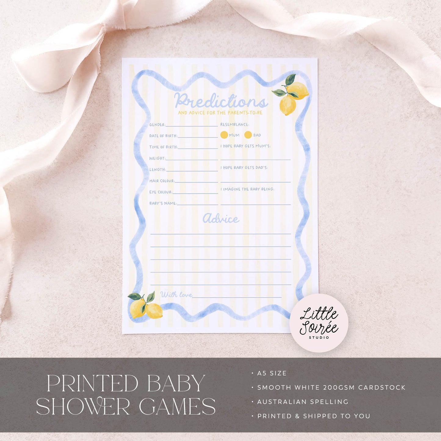 Baby shower game card with lemon design on a light pink fabric background