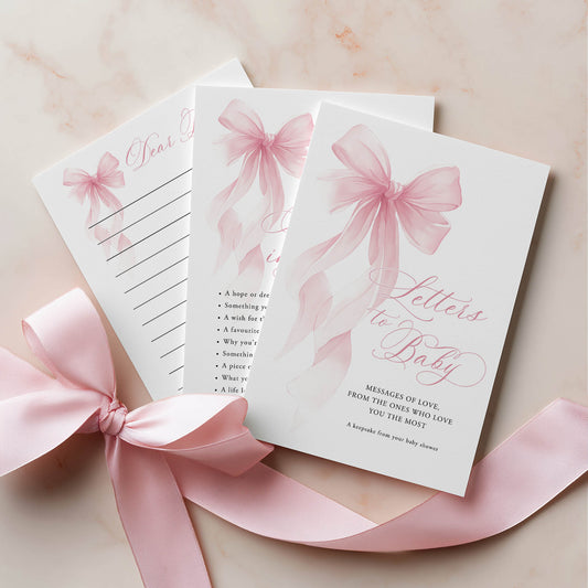 Stationery set with pink ribbons on a light background