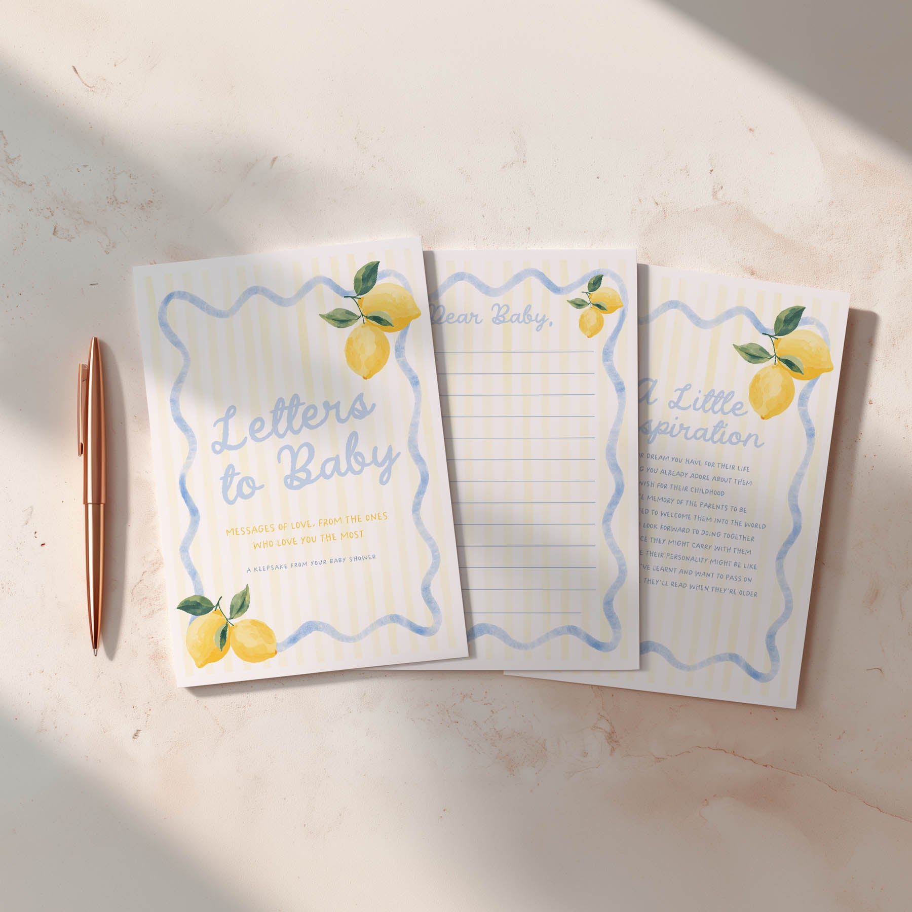 Set of three letter-sized paper pads with lemon illustrations on a light surface.