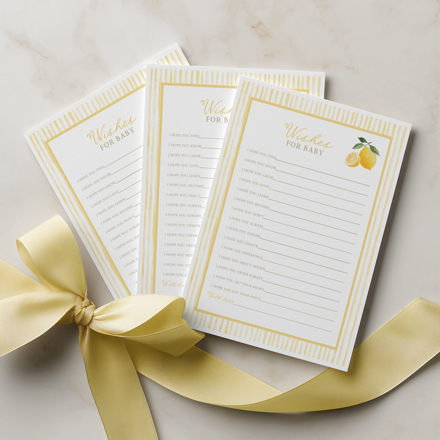 Three lined paper sheets with decorative borders and a lemon illustration, tied together with a yellow ribbon on a light background.