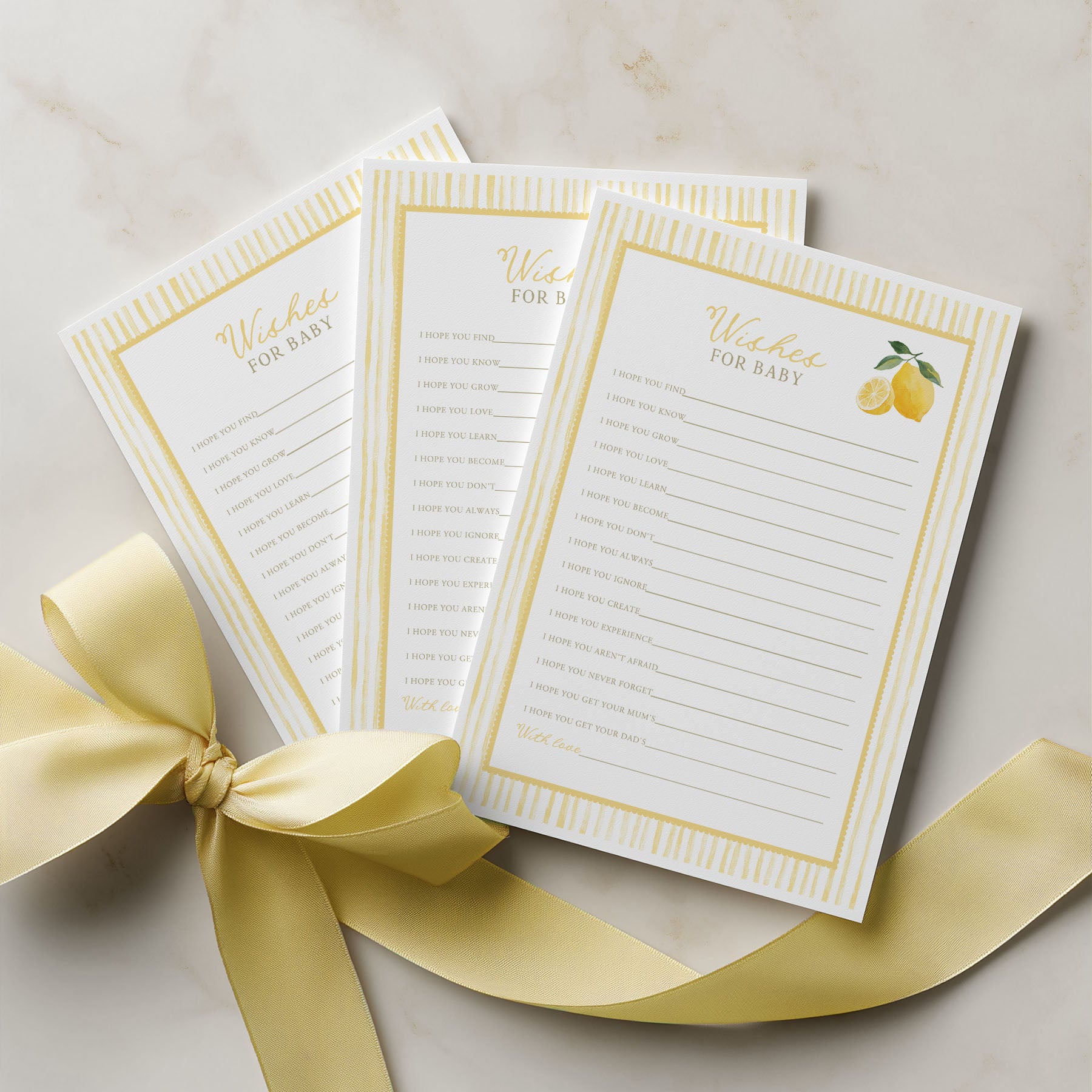 Three lined paper sheets with decorative borders and a lemon illustration, tied together with a yellow ribbon on a light background.