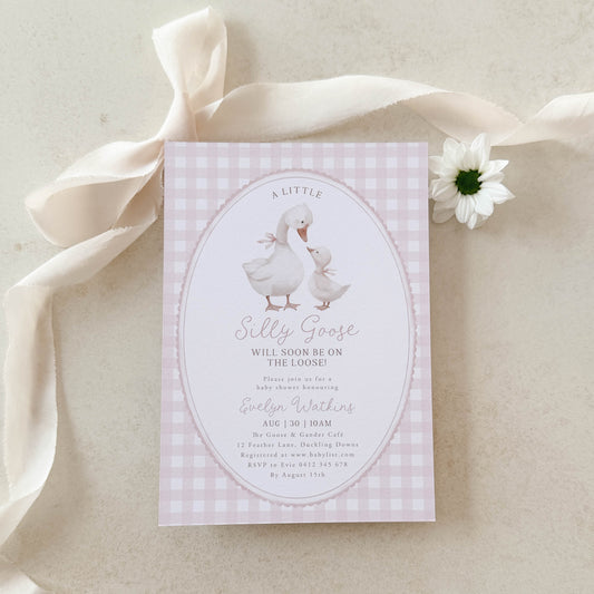 Silly Goose Baby Shower Invitation card with a goose illustration on a pink gingham background, surrounded by ribbons and a flower.
