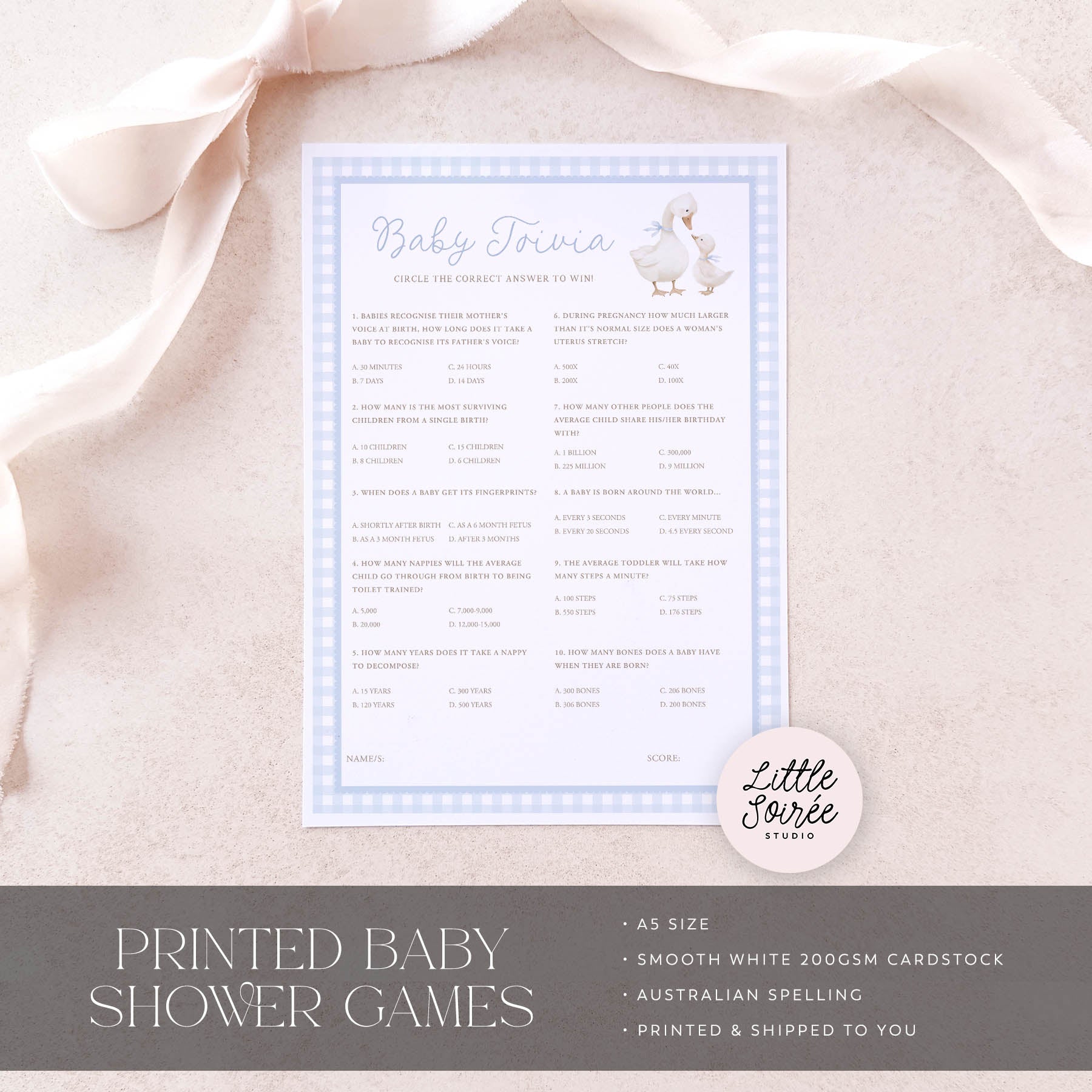 Baby trivia game card on a soft fabric background with 'Little Sourie Studio' branding.