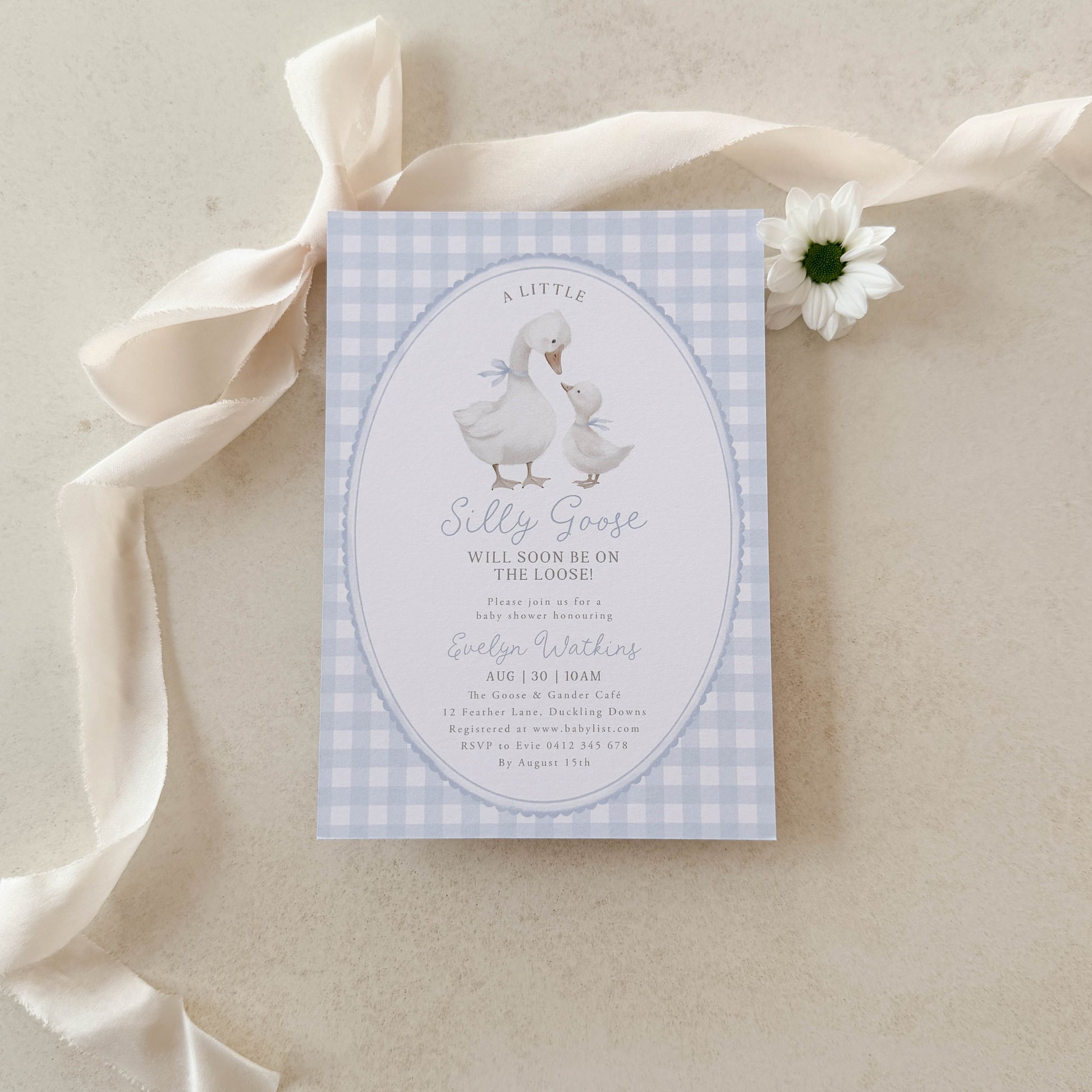 Silly Goose Blue Baby shower invitation with a goose illustration on a checkered background, surrounded by ribbons and a flower.