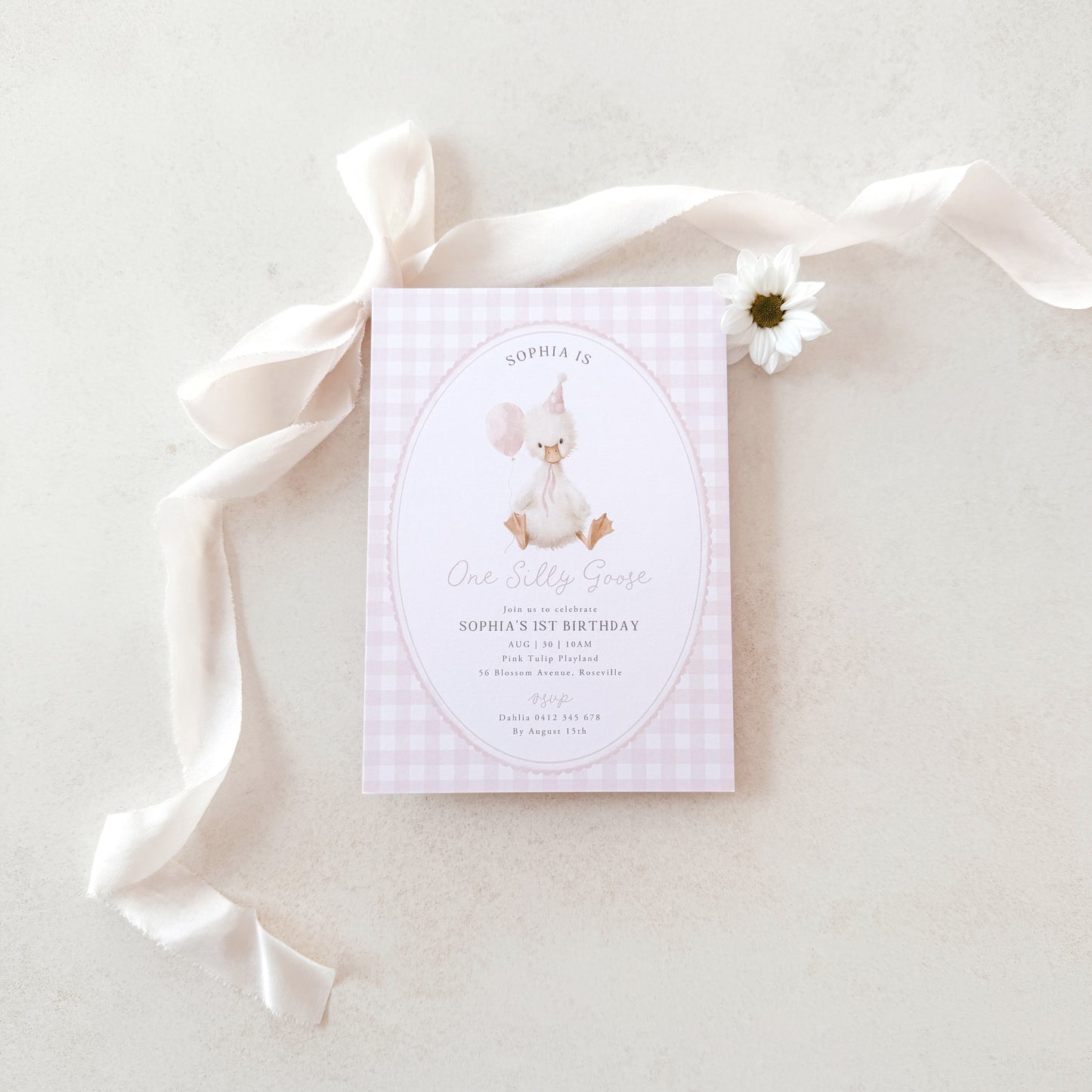 Invitation card for a birthday party with a silly goose design on a light fabric background.