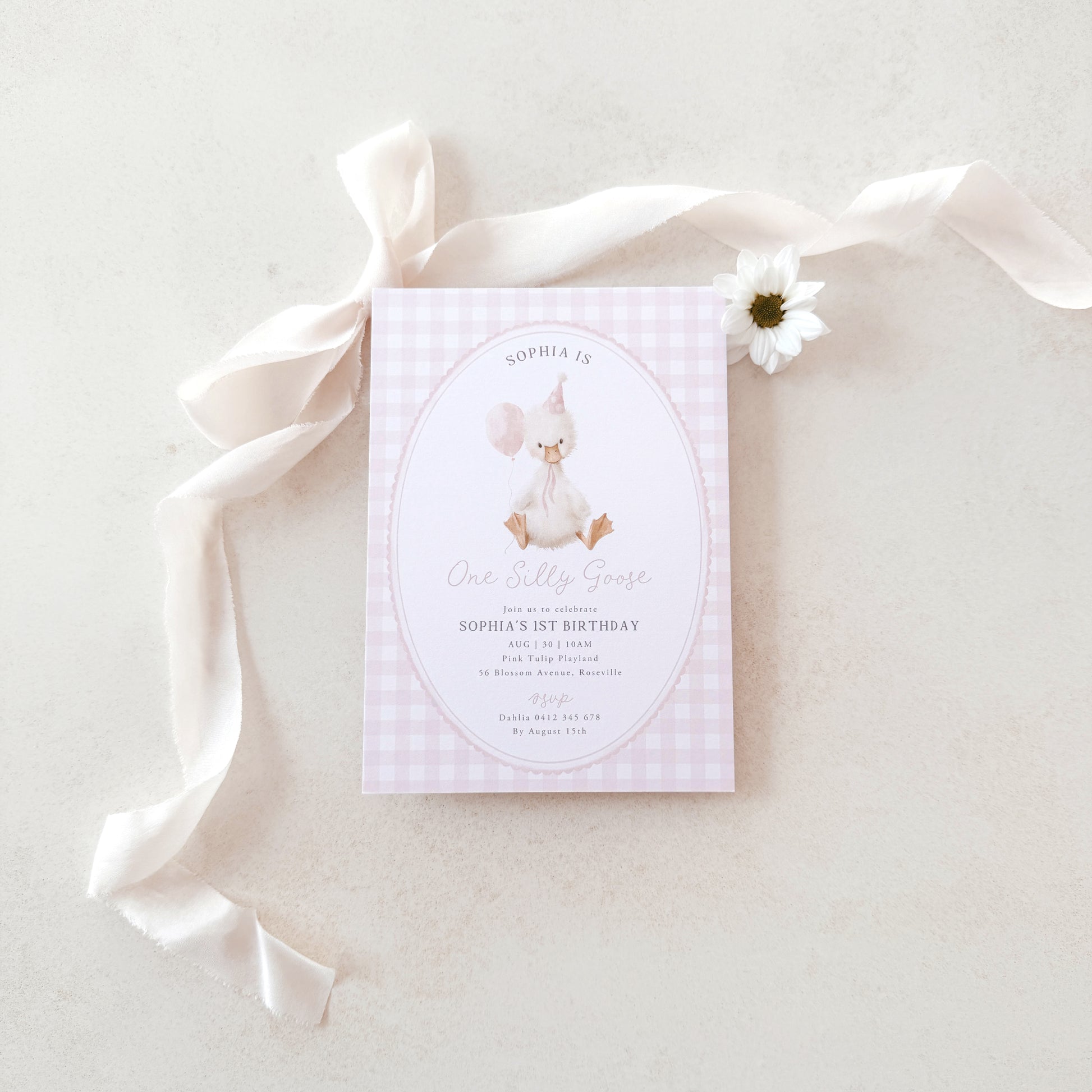 Invitation card for a birthday party with a silly goose design on a light fabric background.