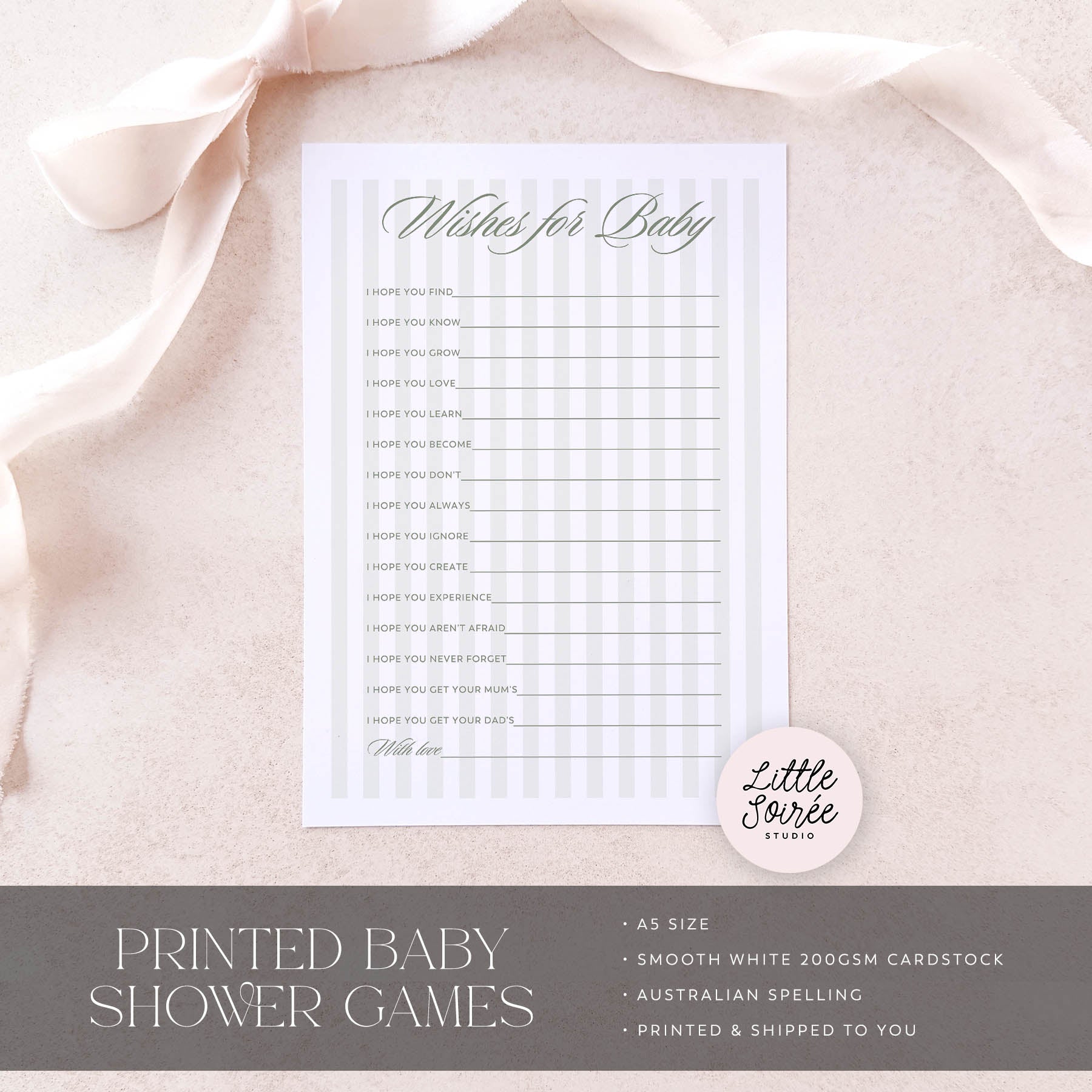 Baby shower game card on a soft pink fabric background with 'Little Souris Studio' branding.
