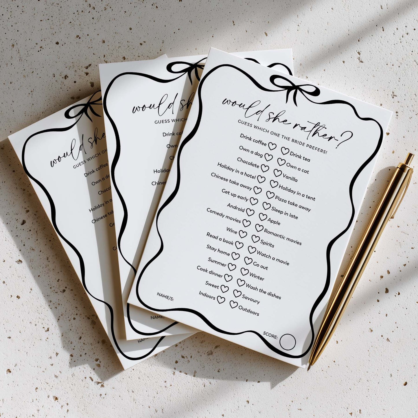 Three 'would she rather?' question cards with a pen on a textured surface