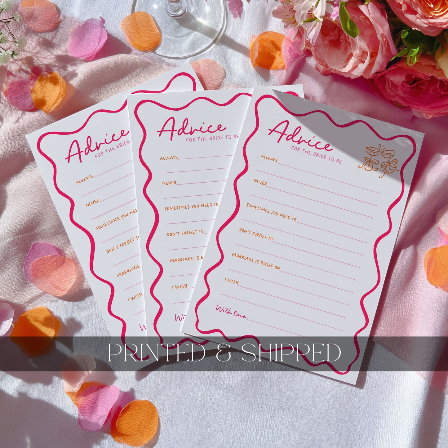 Three white 'Advice for the Bride' cards with pink wavy borders and gold foil text, arranged on a white fabric surface with pink rose petals and flowers. A translucent banner at the bottom reads 'PRINTED & SHIPPED'.