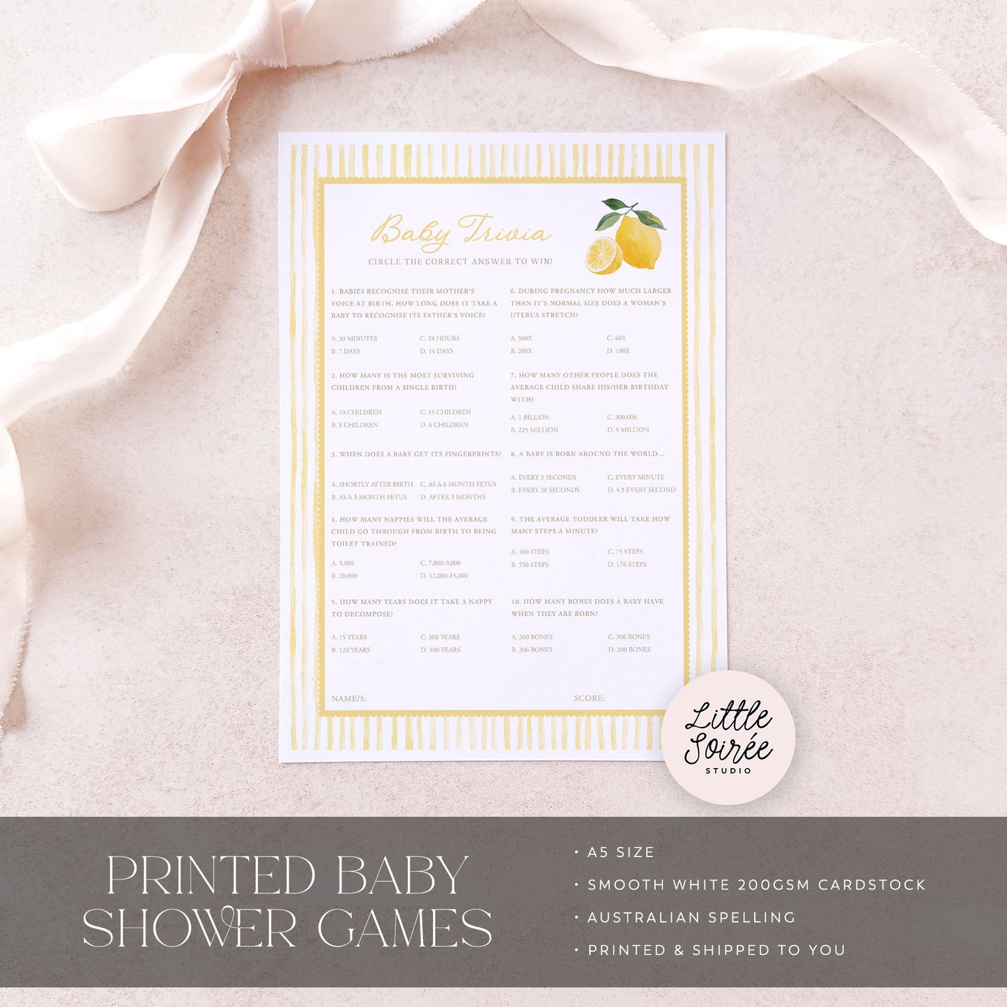 Baby shower game sheet with lemon design on a light pink fabric background