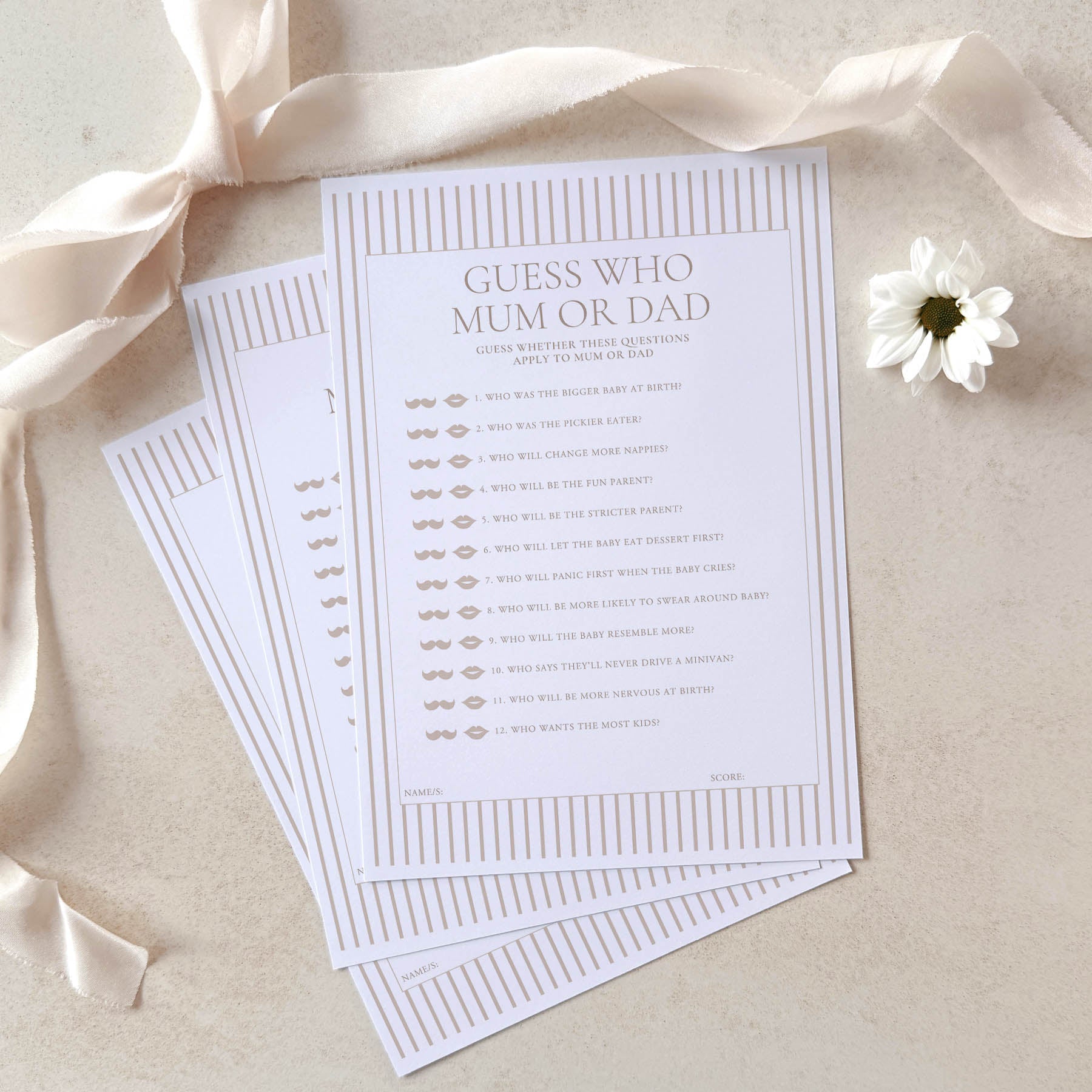 Guess Who Mum or Dad game cards with ribbons and a flower on a beige background