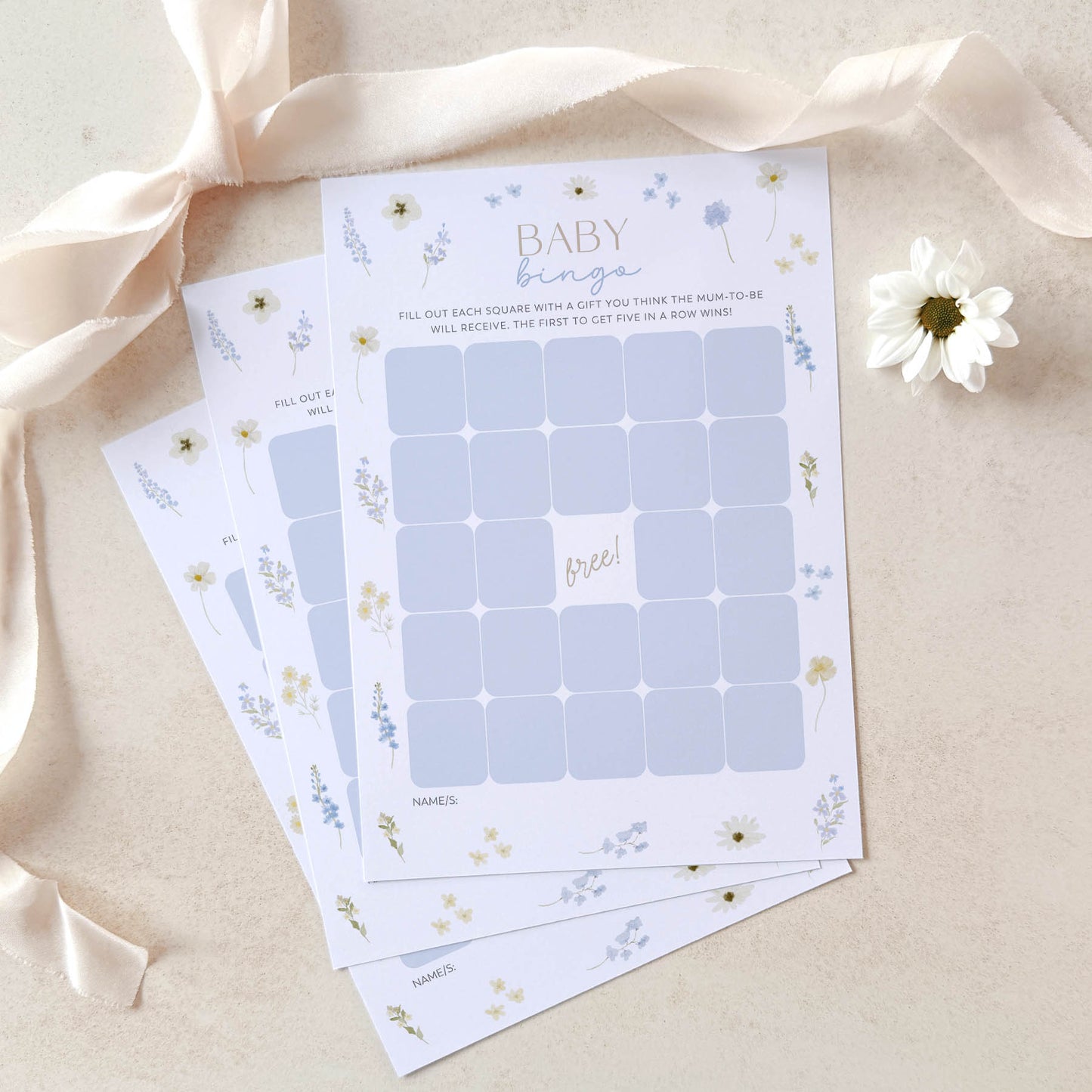 Baby shower game sheets with floral design on a light background