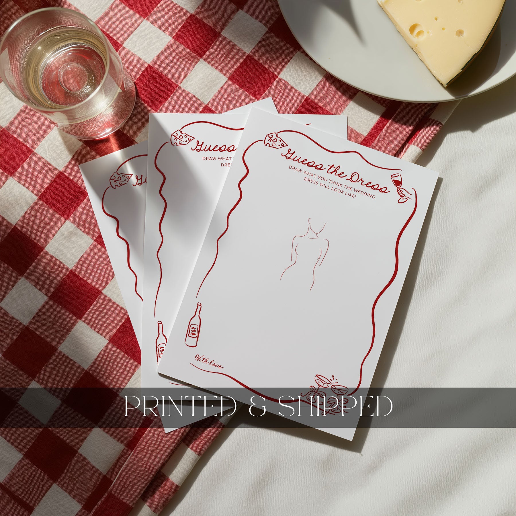 Two printed 'Old Fashioned Advice' cards on a red and white checkered tablecloth with a glass of water and cheese.