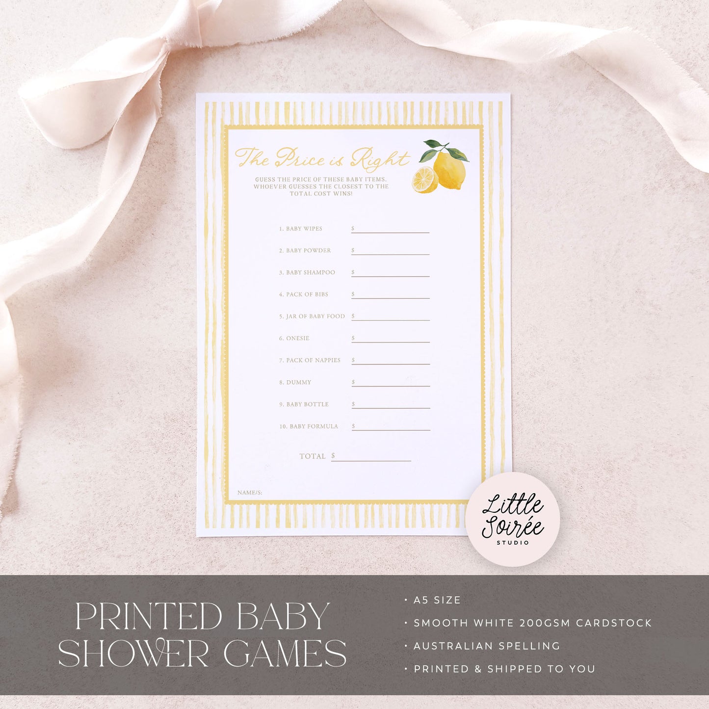 Baby shower game card with lemon design on a light pink fabric background