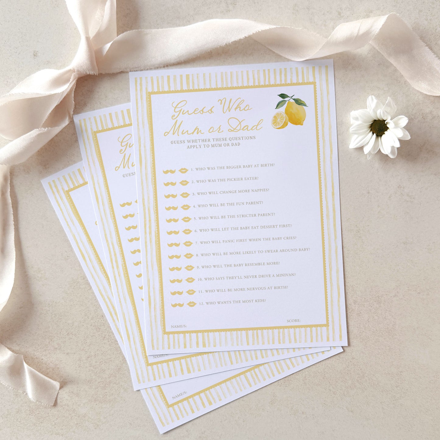 Baby shower game cards with lemon design on a beige background with ribbon and flower.