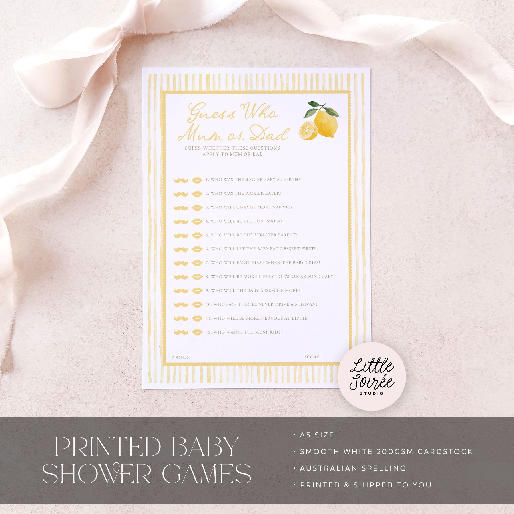 Baby shower game card with lemon design on a soft pink fabric background, featuring 'Little Sourie Studio' branding.