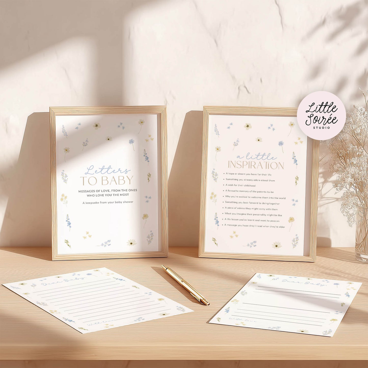 Framed prints and stationery items on a wooden surface with 'Little Sorrell Studio' branding.