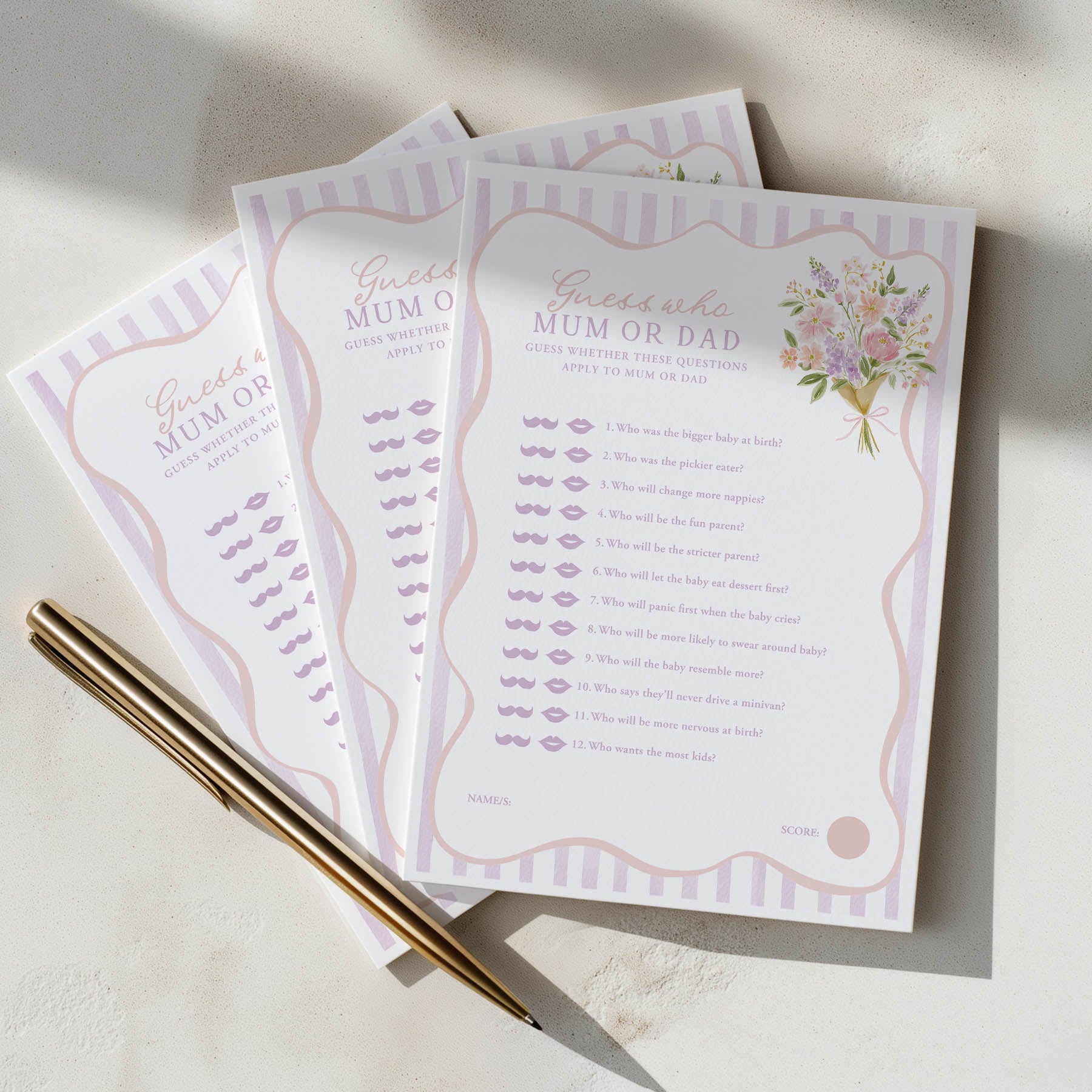 Three printed questionnaires titled 'Guess who? Mum or Dad' on a light surface with a pen.