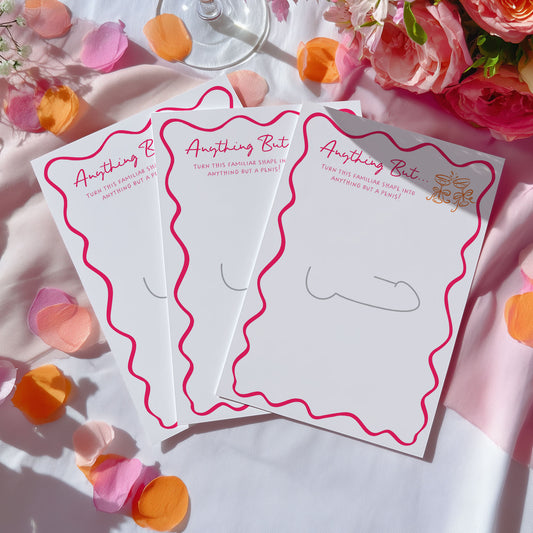 Three white notepad cards with pink wavy borders and the phrase 'Anything But' in pink script, arranged on a white fabric surface with pink and orange flower petals and flowers around them.