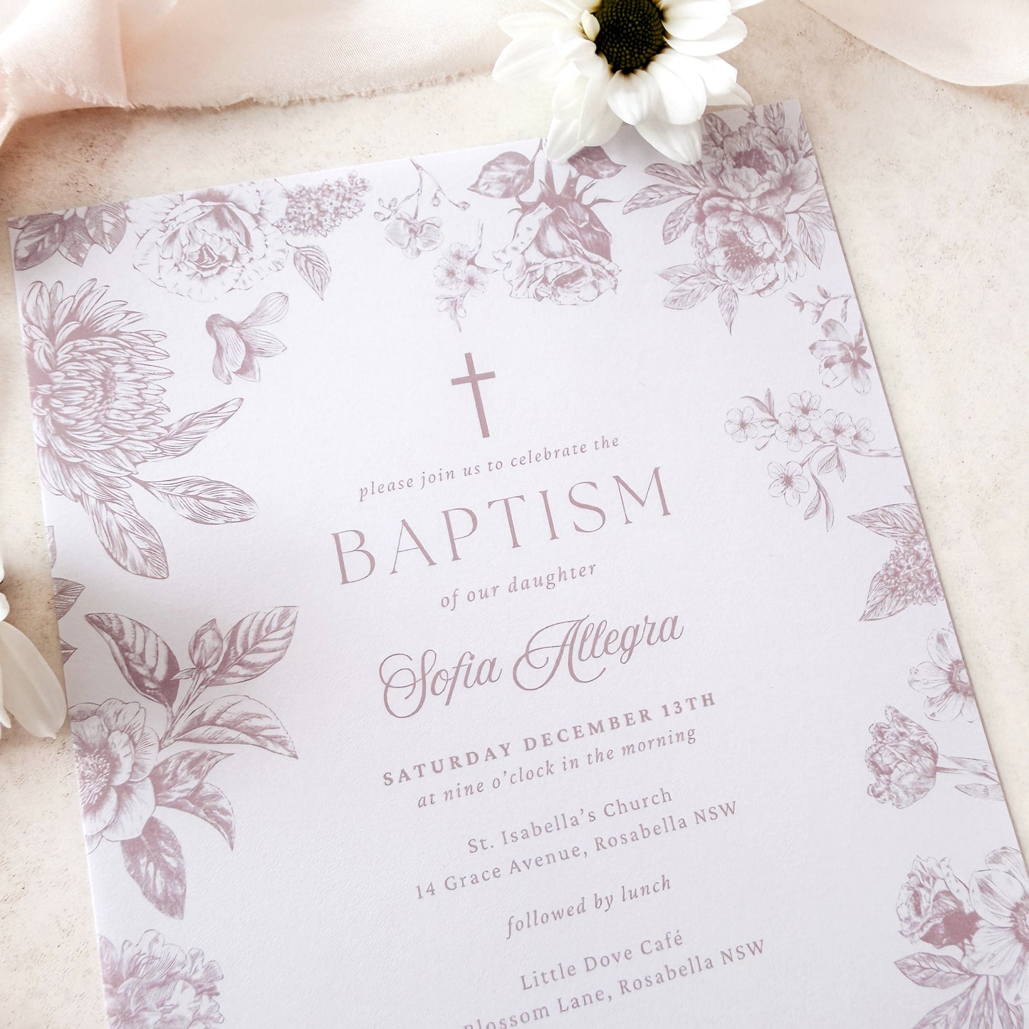 Baptism invitation with floral design and cross on a light background