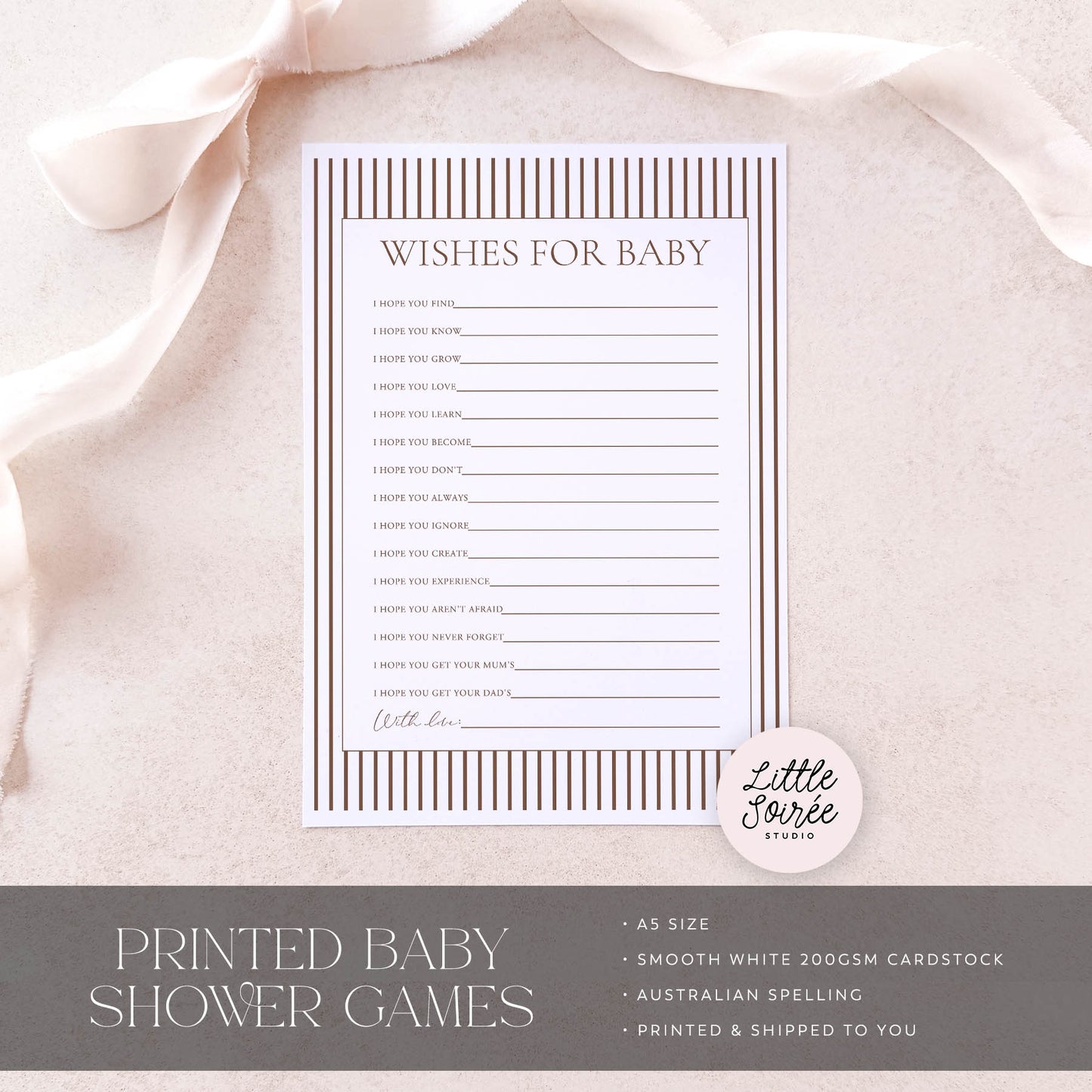 Baby shower game card titled 'Wishes for Baby' on a soft pink fabric background with 'Little Souris Studio' branding.