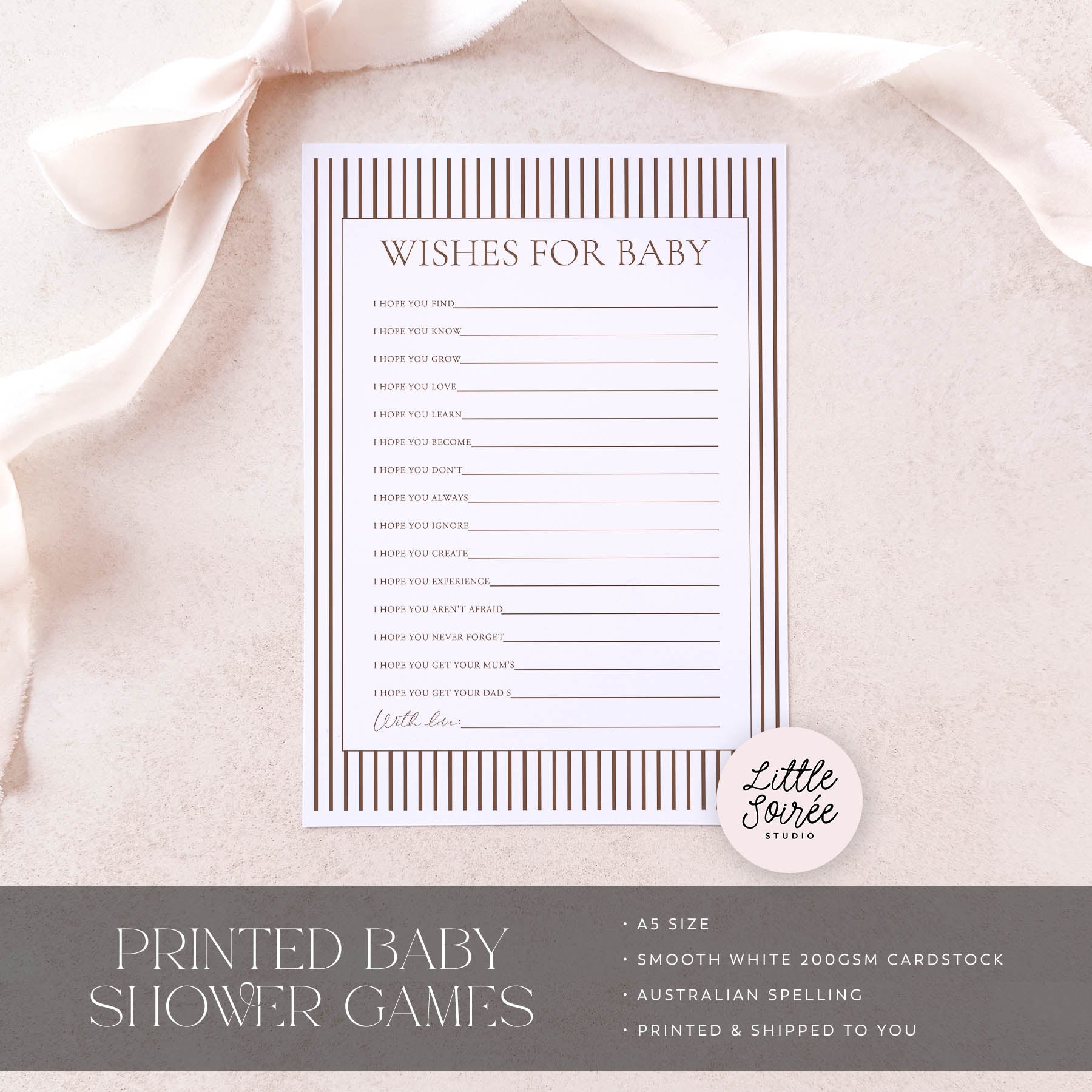 Baby shower game card titled 'Wishes for Baby' on a soft pink fabric background with 'Little Souris Studio' branding.