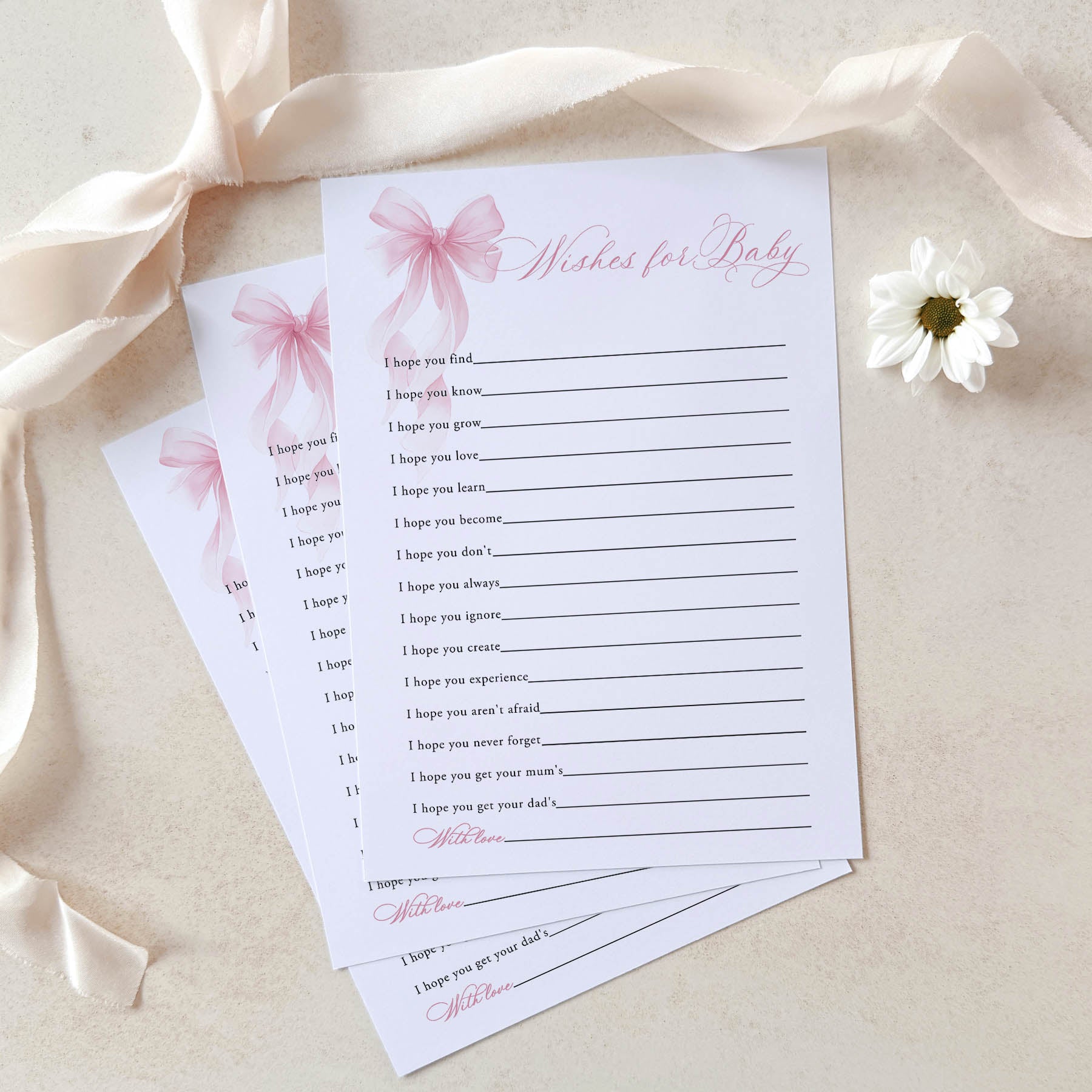 Baby shower wish cards with a duck illustration on a beige background with ribbons and a flower.