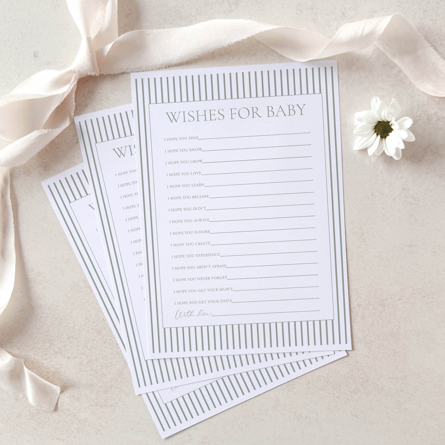Baby shower game cards titled 'Wishes for Baby' on a light background with ribbons and a flower.
